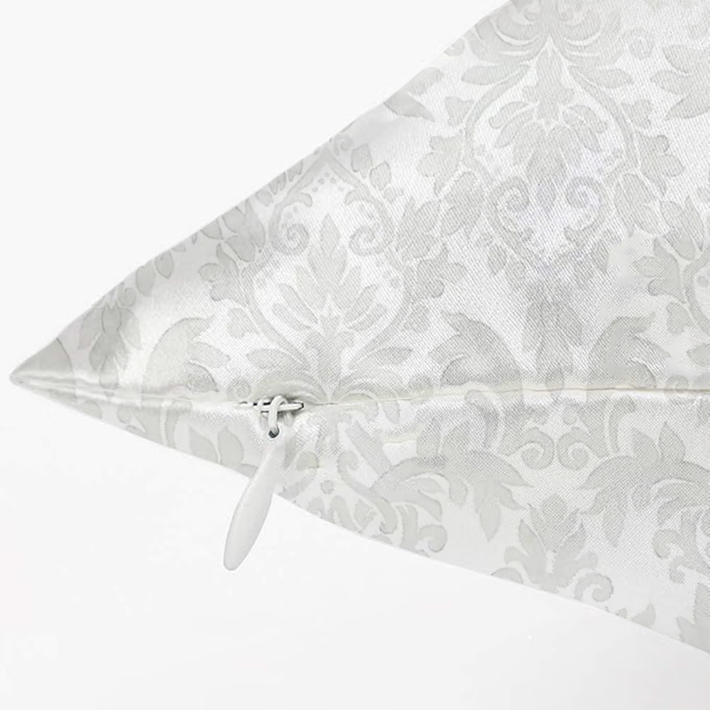 Invisible zipper detail on white silk pillowcase