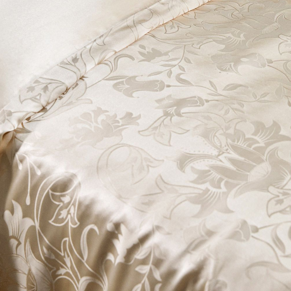 Damask jacquard pattern detail on silk bedsheet