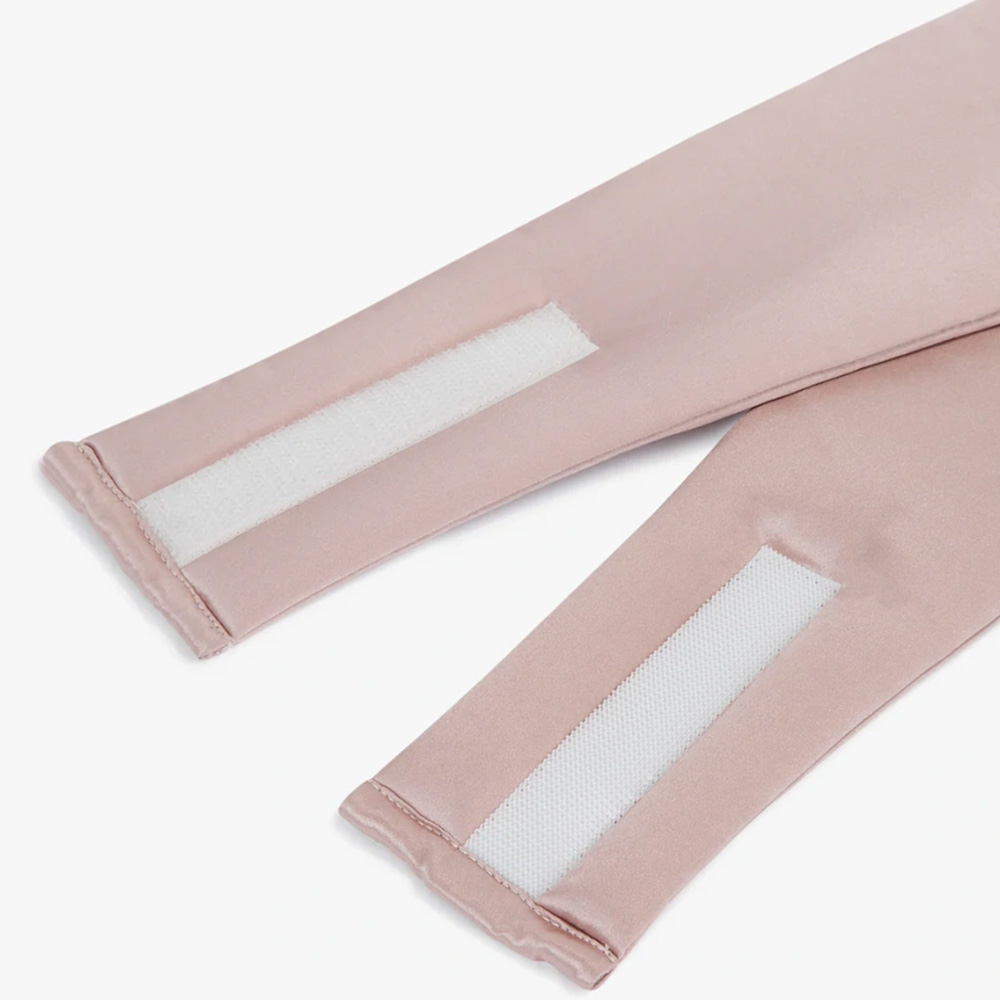 Velcro closure detail on pink silk sleep mask