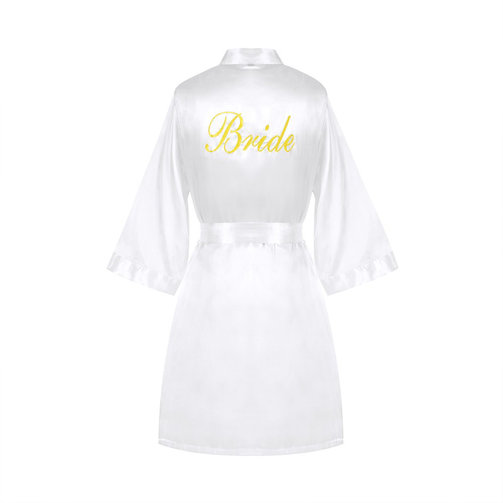 Back view of white silk bridal robe with gold Bride embroidery