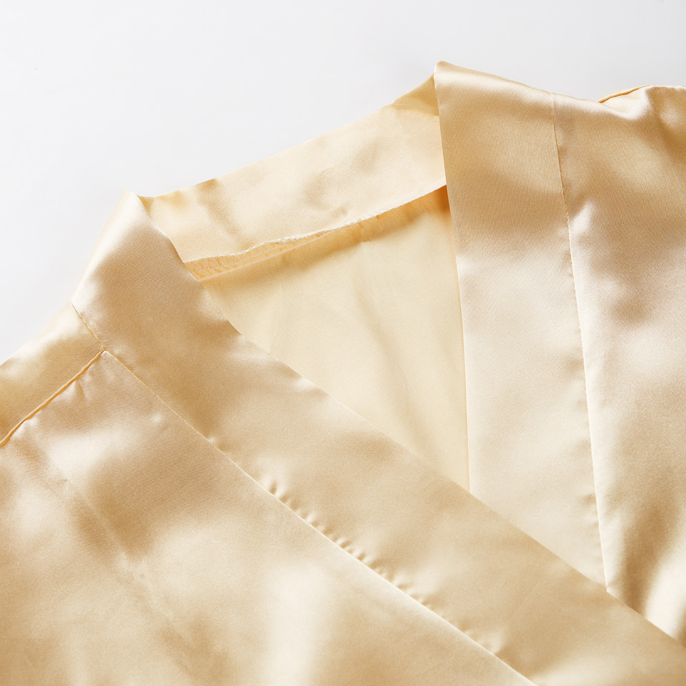 Neckline detail of women's golden silk kimono robe