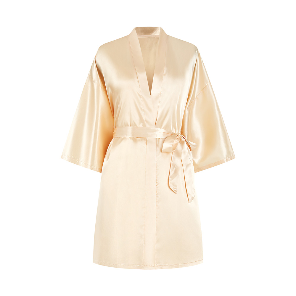 Short golden silk kimono bathrobe flat lay