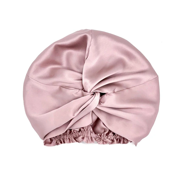 Pink silk twist hair turban sleep bonnet flat lay