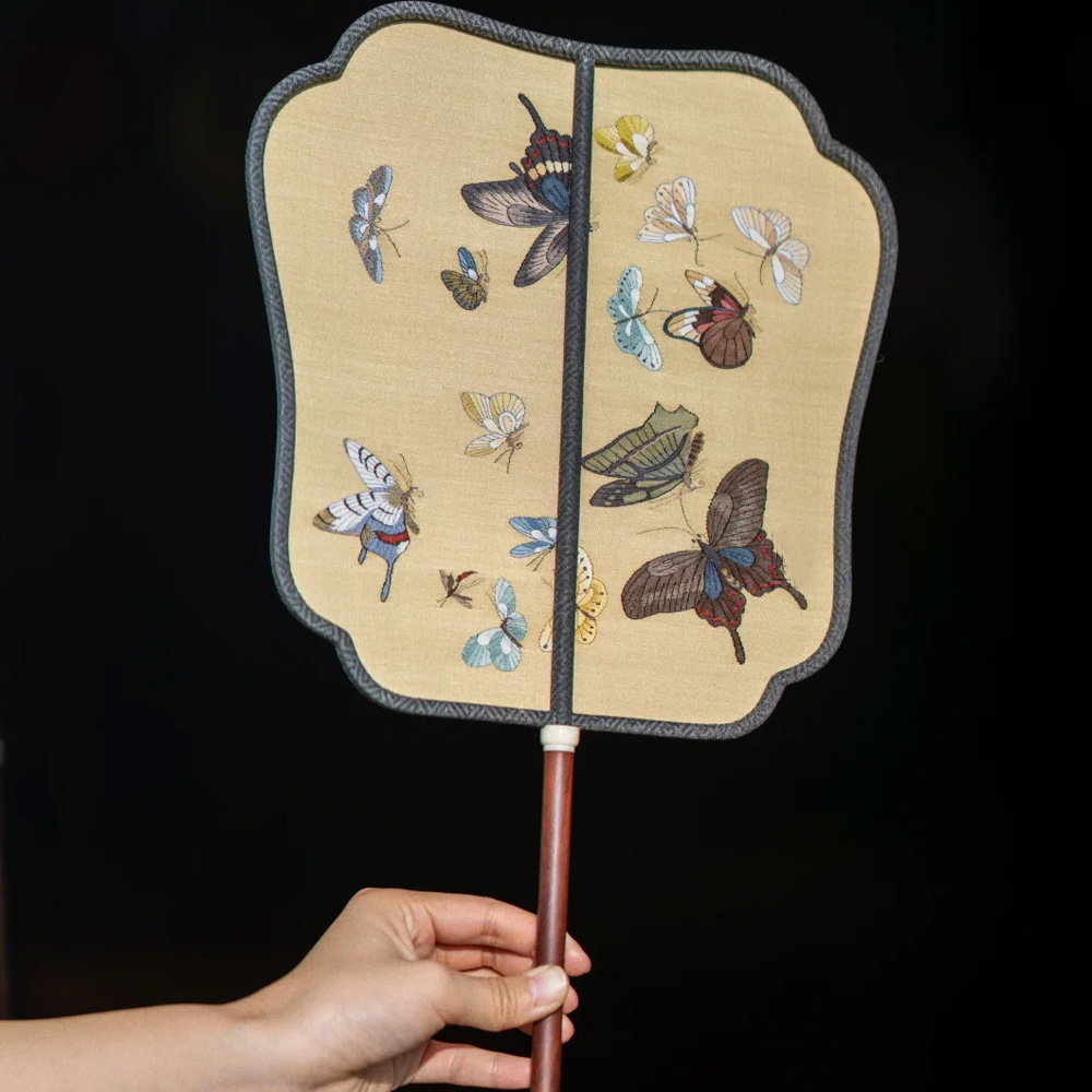 Chinese embroidered silk hand fan with wooden handle